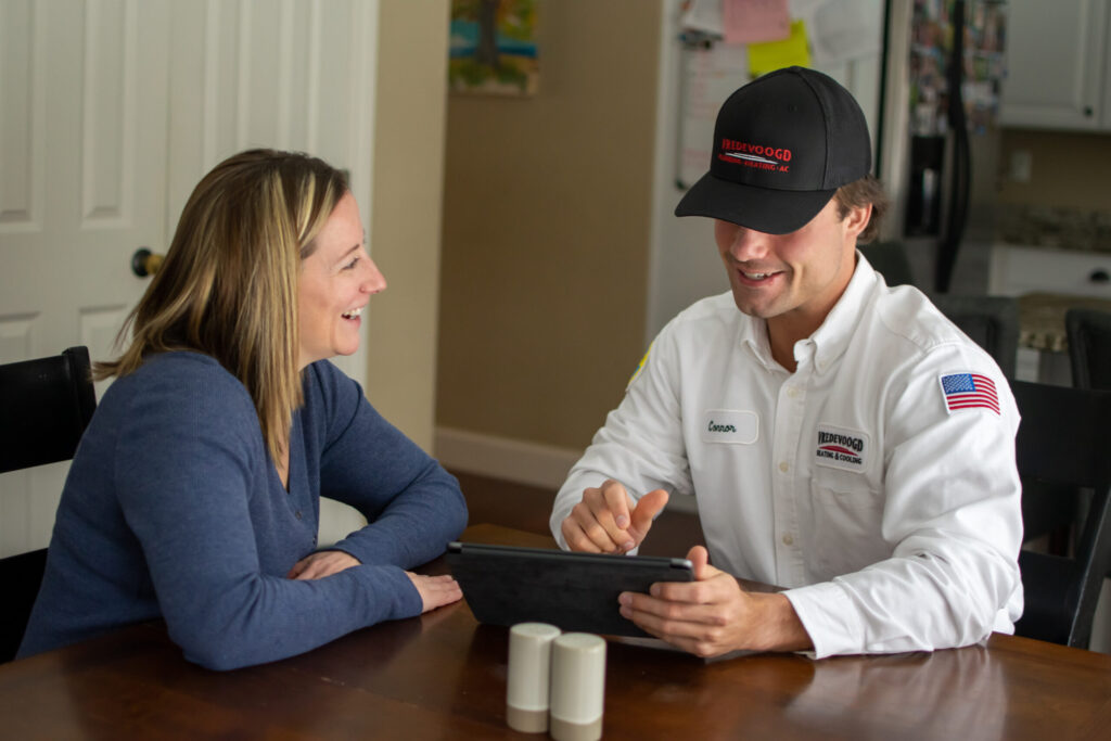 Vredevoogd technician speaking with a Wyoming, MI homeowner