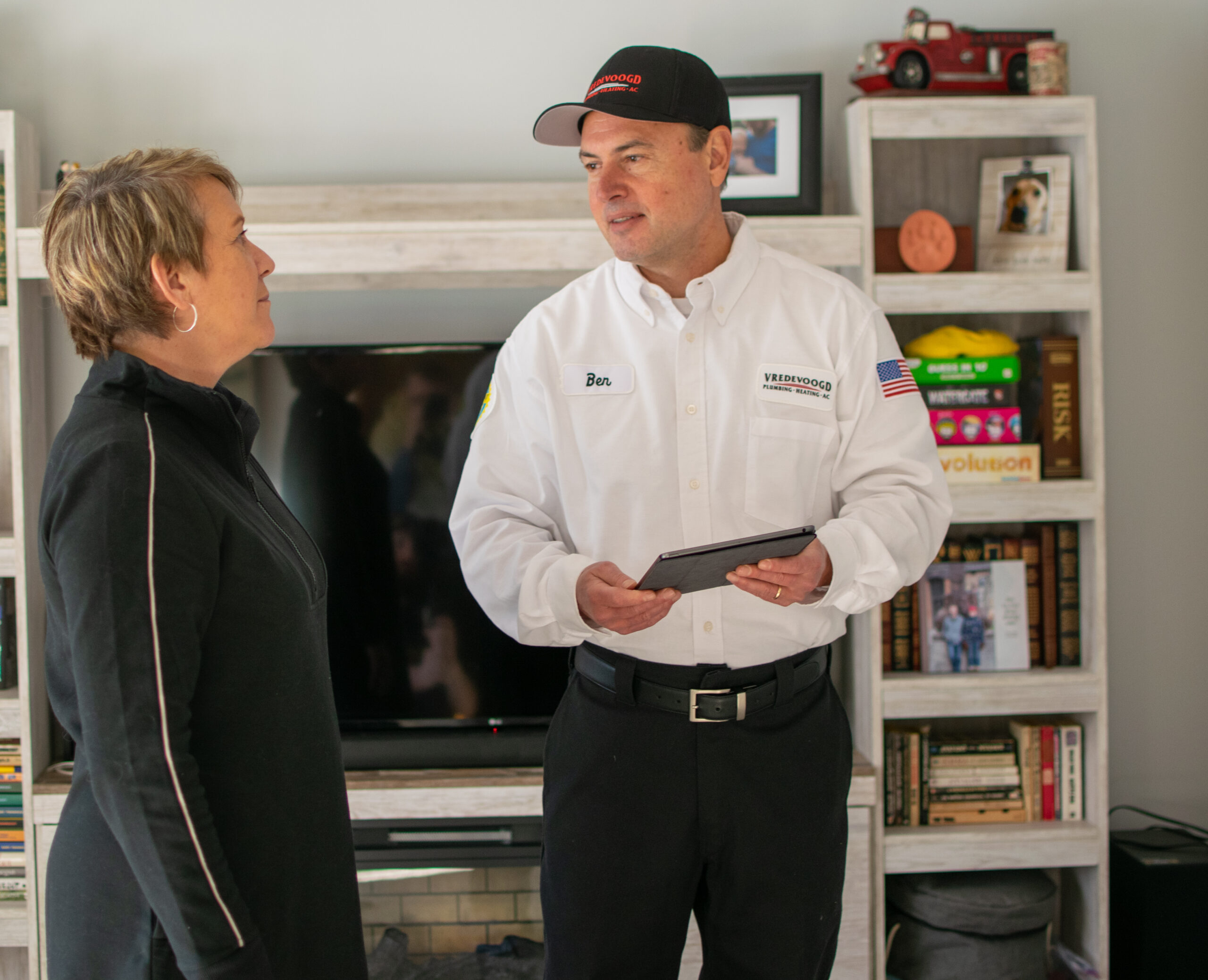 Vredevoogd technician speaking with a Michigan homeowner