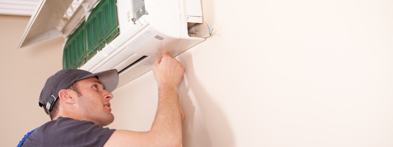 HVAC technician working on a ductless min-split