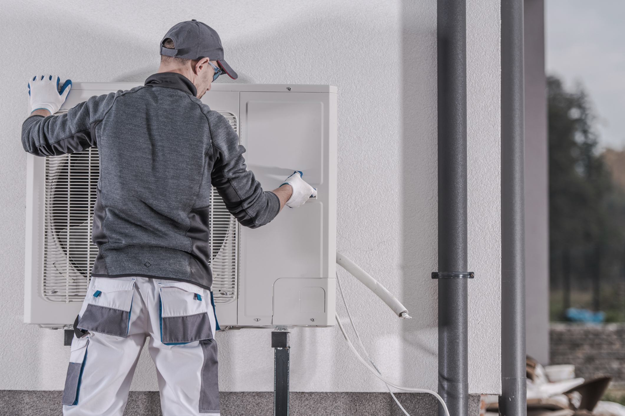 Technician performing a heat pump repair service