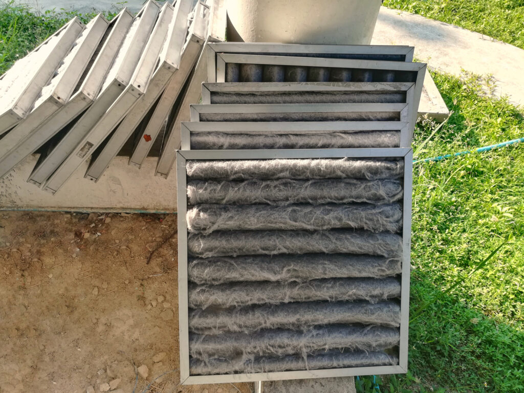 Stack of dirty air filters in the front & clean air filters in the back